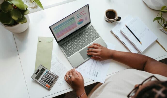 Image of a woman typing on a computer