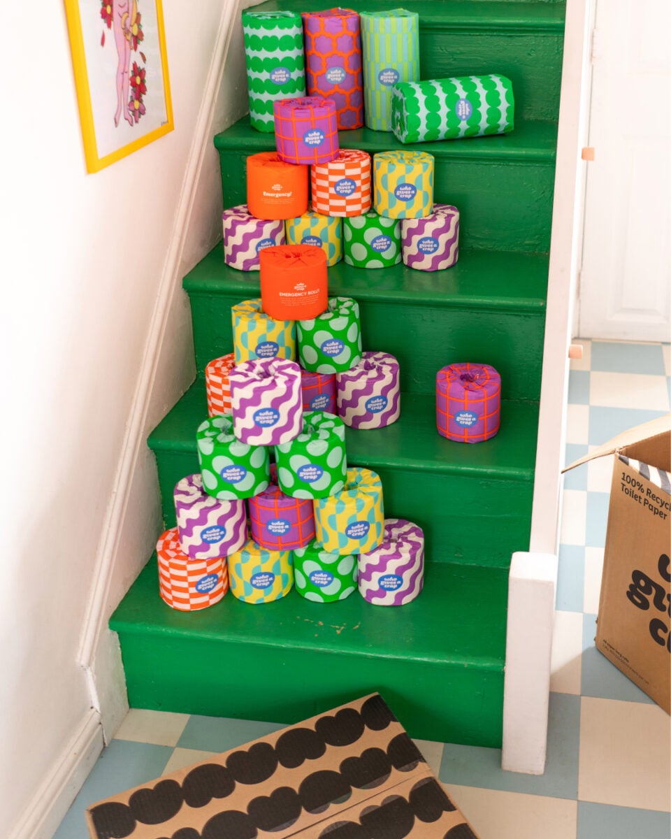 sustainable and colourful toilet rolls placed on green stairs